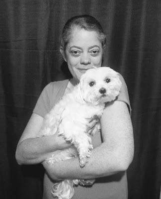 B&W photo of Charity Rowell with Lexi the Maltese